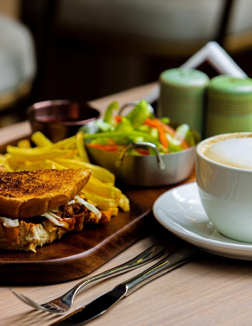 Sandwich with fries and coffee
